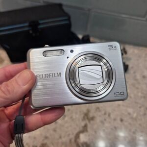 Fujifilm FinePix J150w Digital Camera Silver 10MP 5x Zoom Bundle with Cases Pod